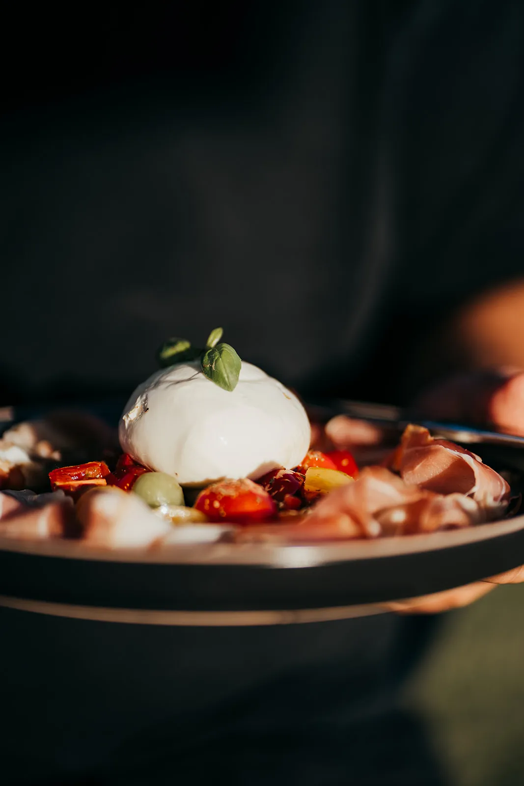 Polished plated dish in strong natural light at a Fleurieu distillery kitchen