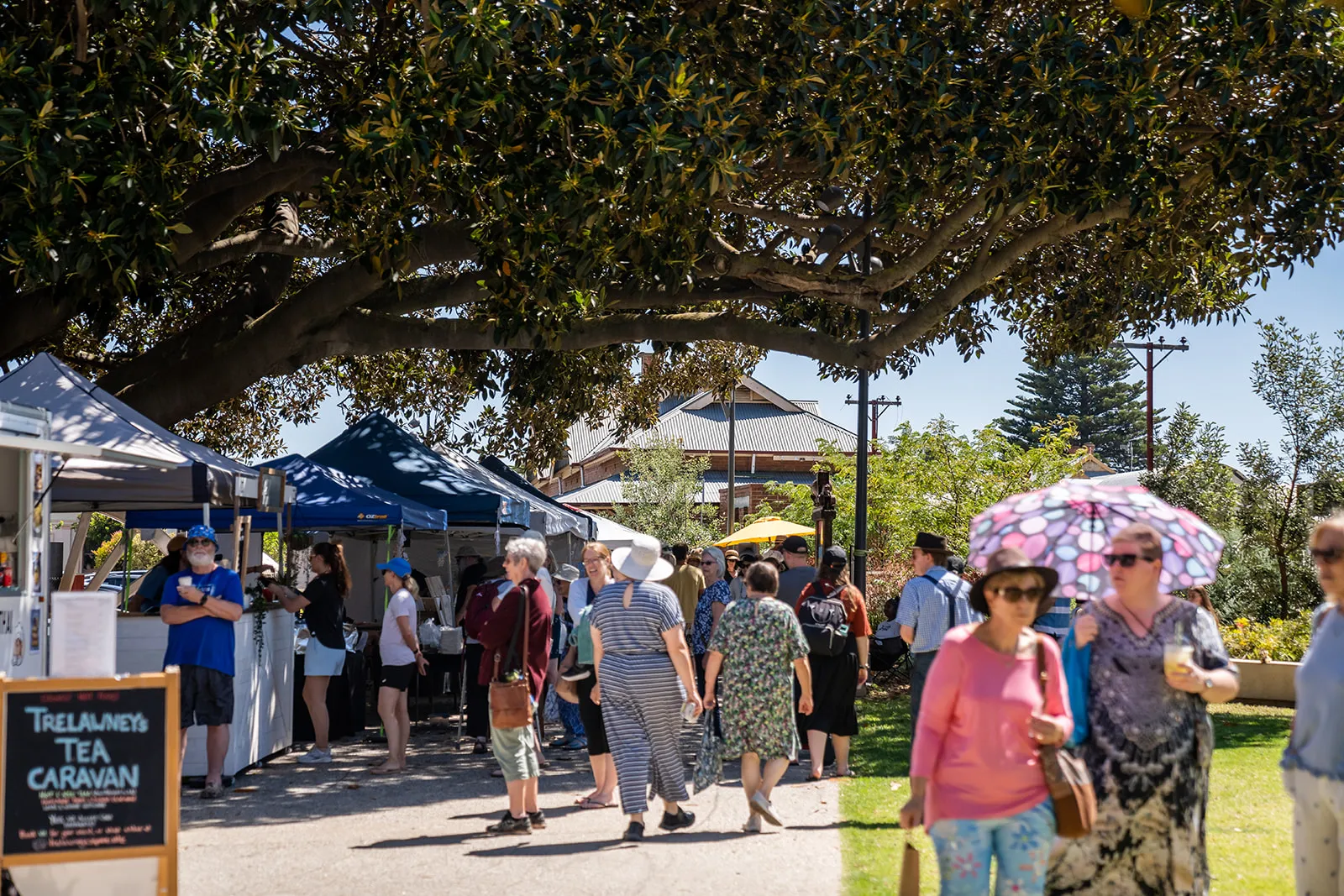 Busy market lane full of visitors at a Fleurieu artisan market