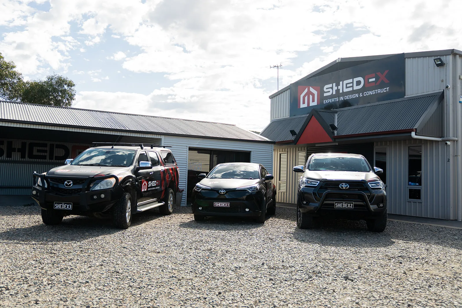 Company premises, signage and branded fleet in one clean frame