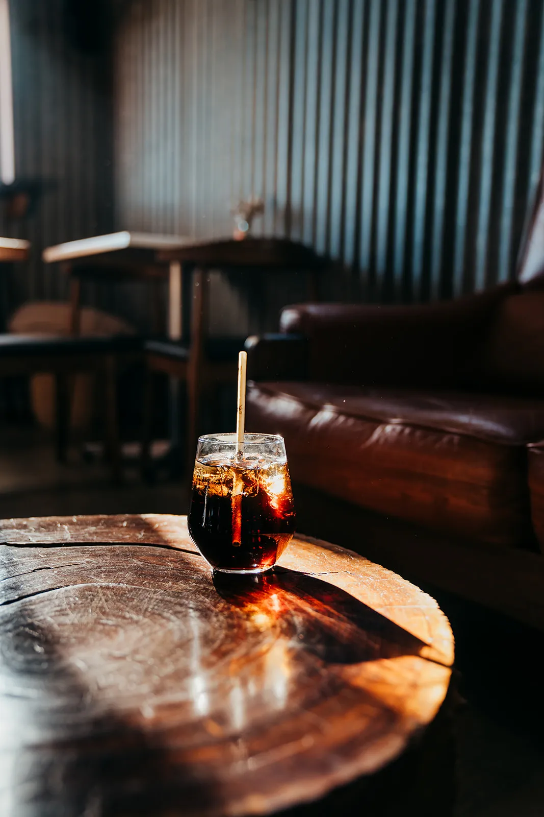 Cocktail resting on a whisky barrel in the distillery lounge
