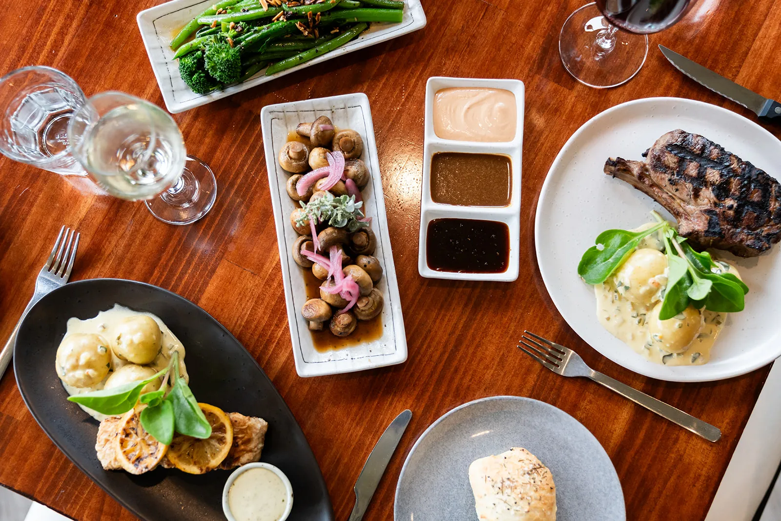 A full table of shared plates ready for guests