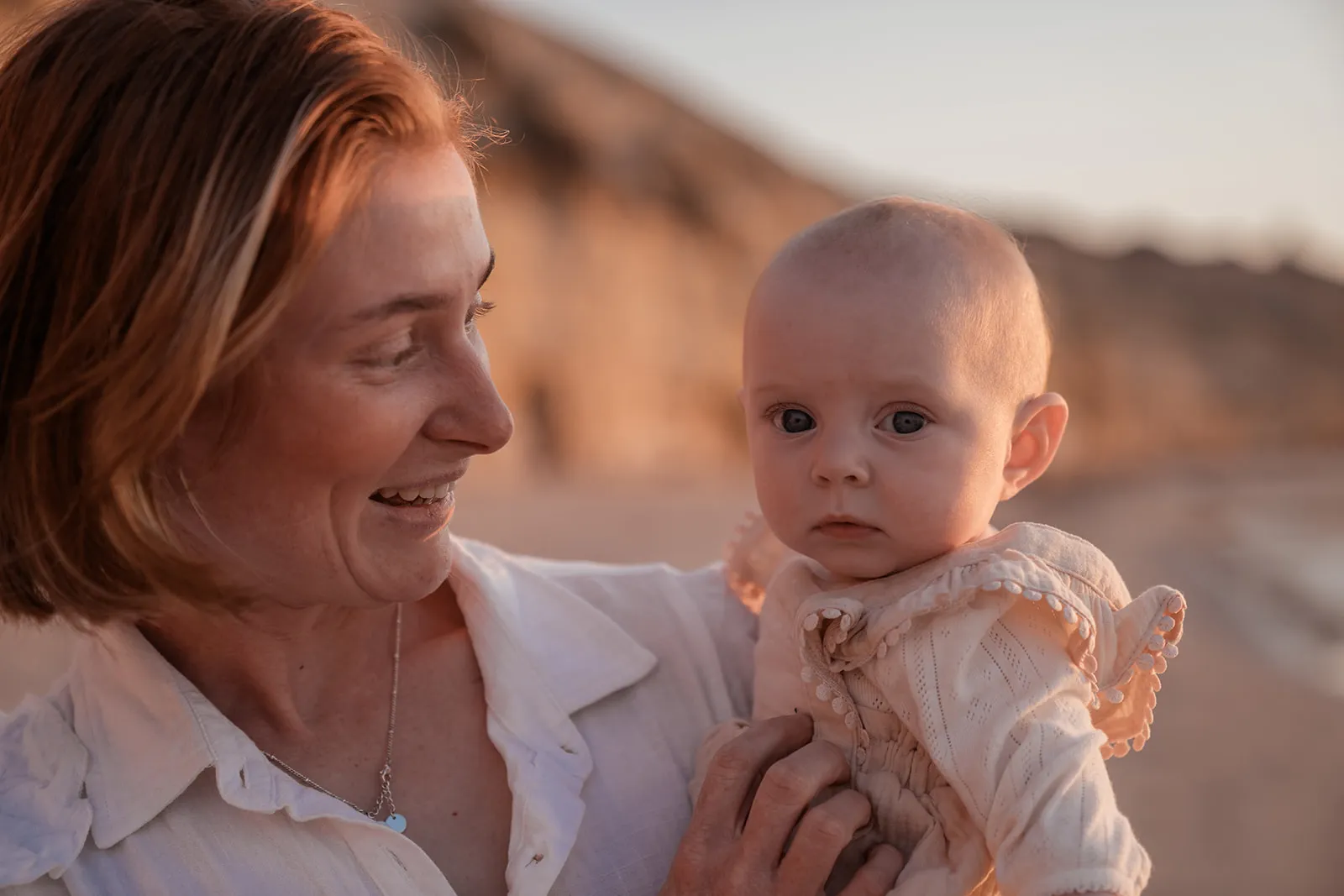 Parents with their baby during a beach family session