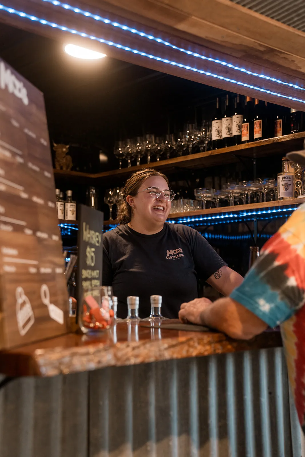 Friendly service behind the distillery bar