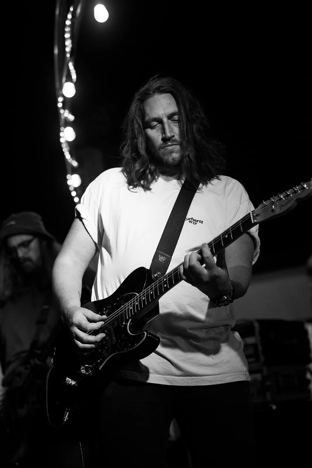 Monochrome guitarist portrait with a classic live-music feel