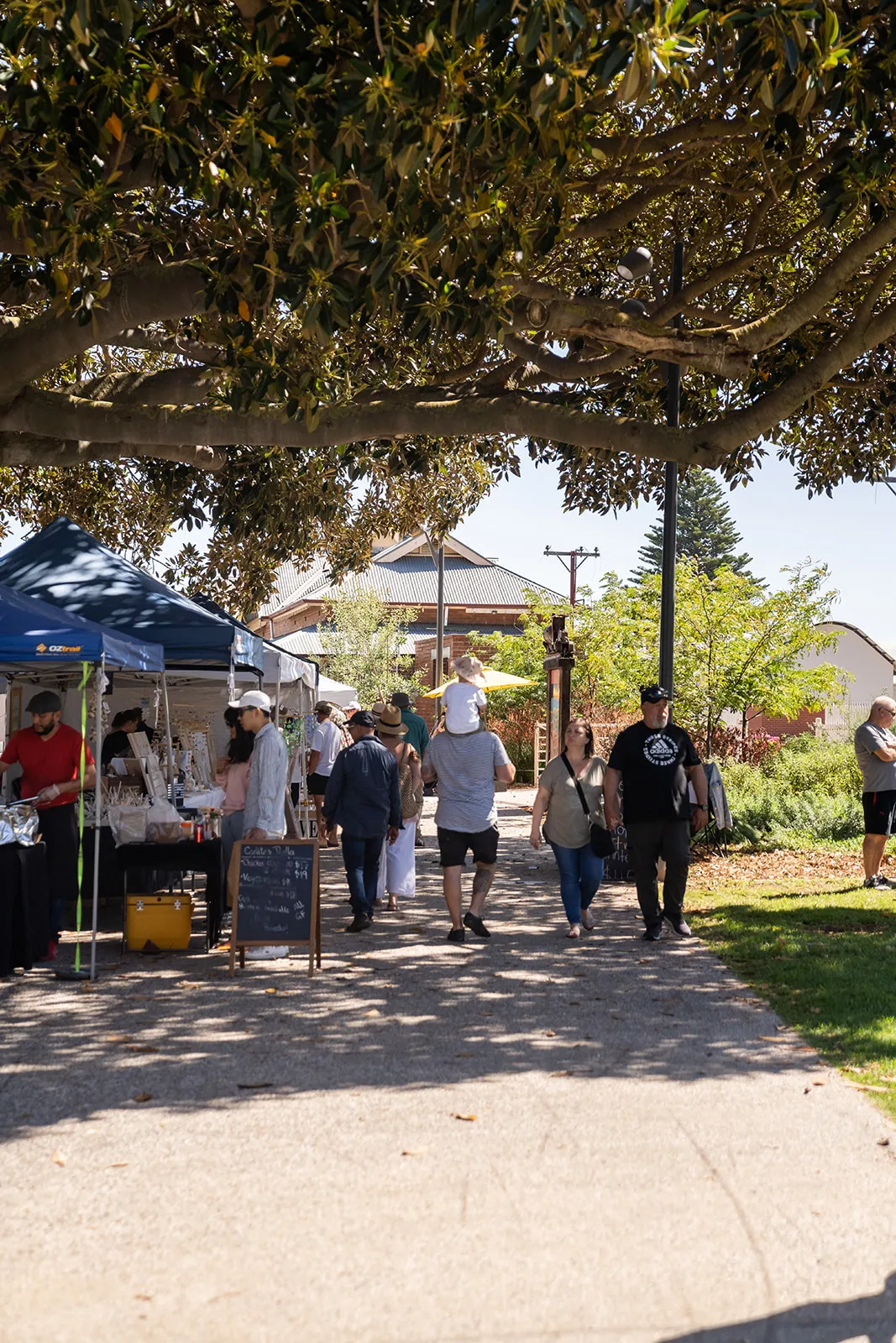 Market stalls and crowds in the open air