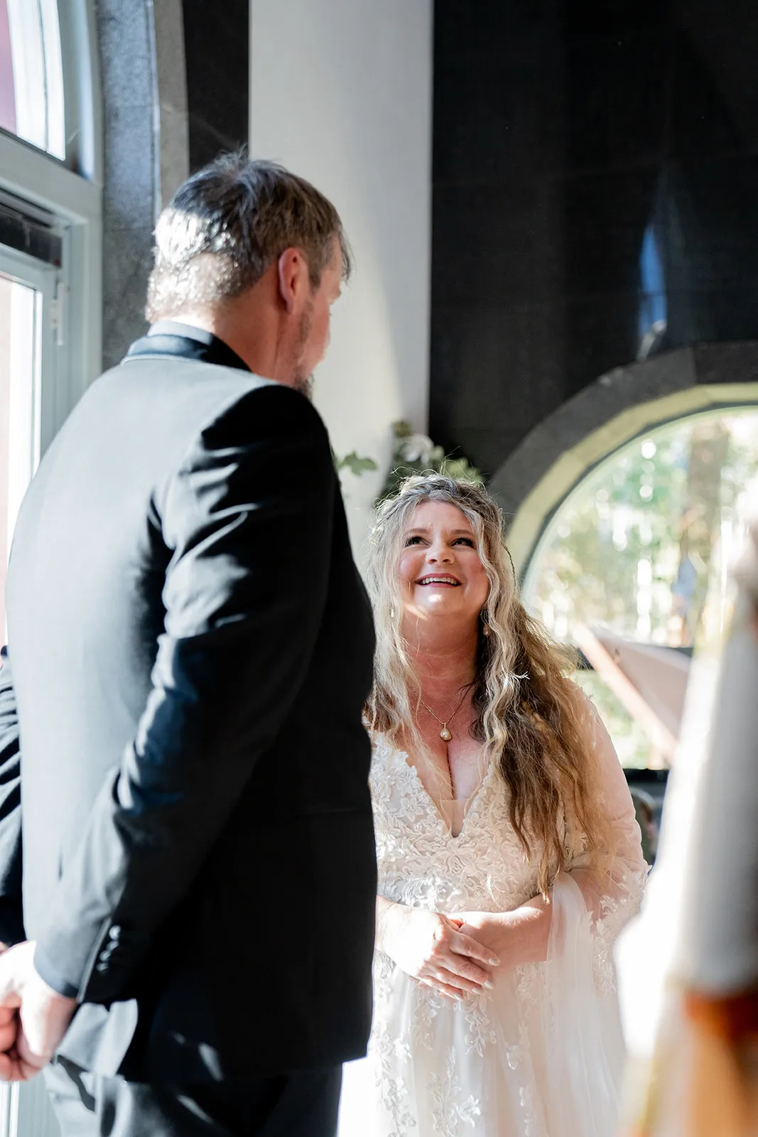 Bride laughing mid-ceremony