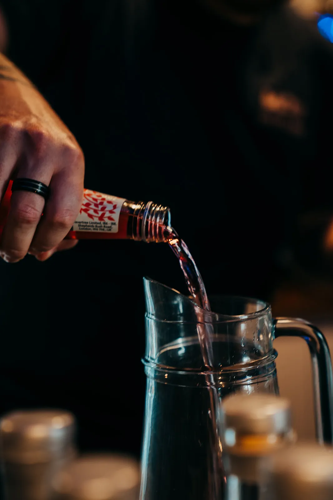 Close-up drink preparation behind the bar