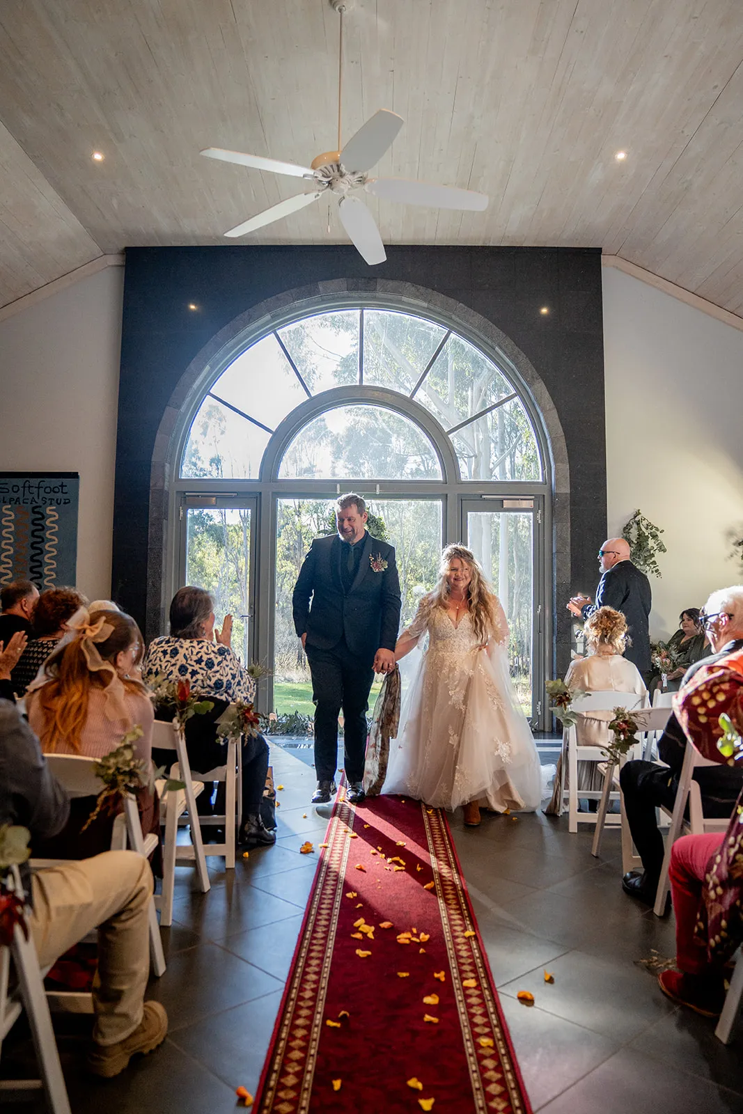 Newlyweds walking back down the aisle