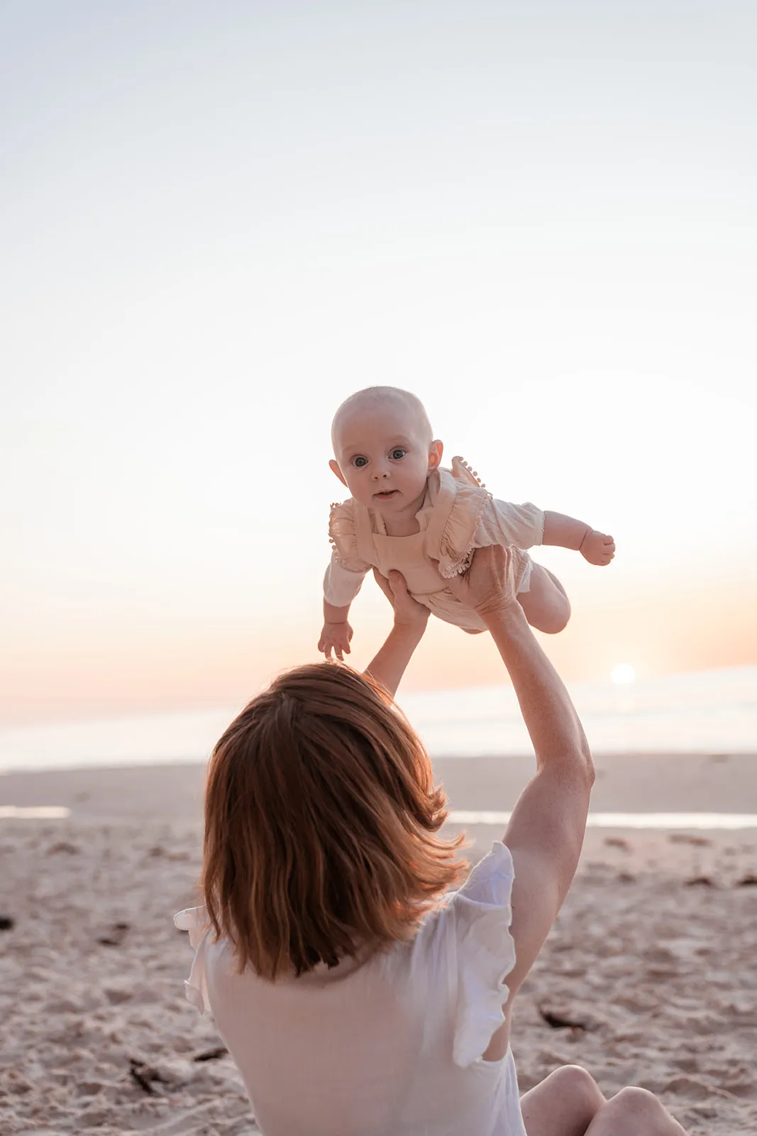 Baby held close during a young-family session