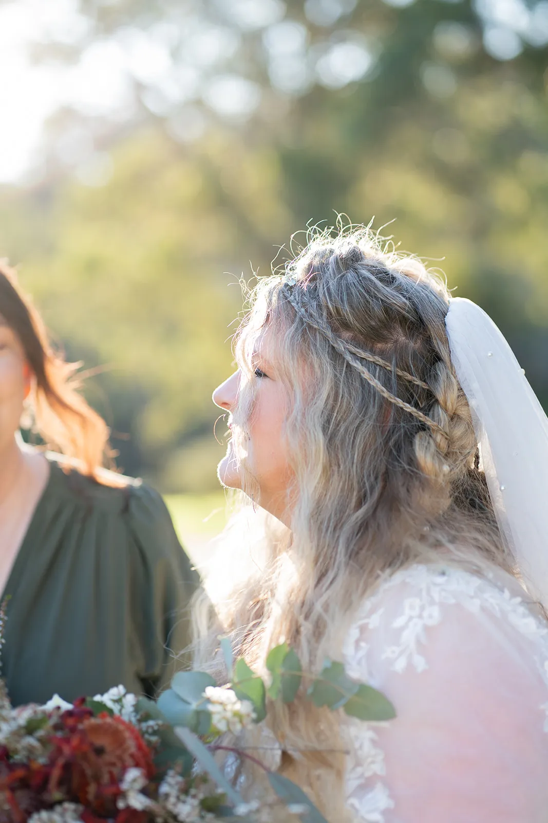 Softly backlit profile portrait of the bride