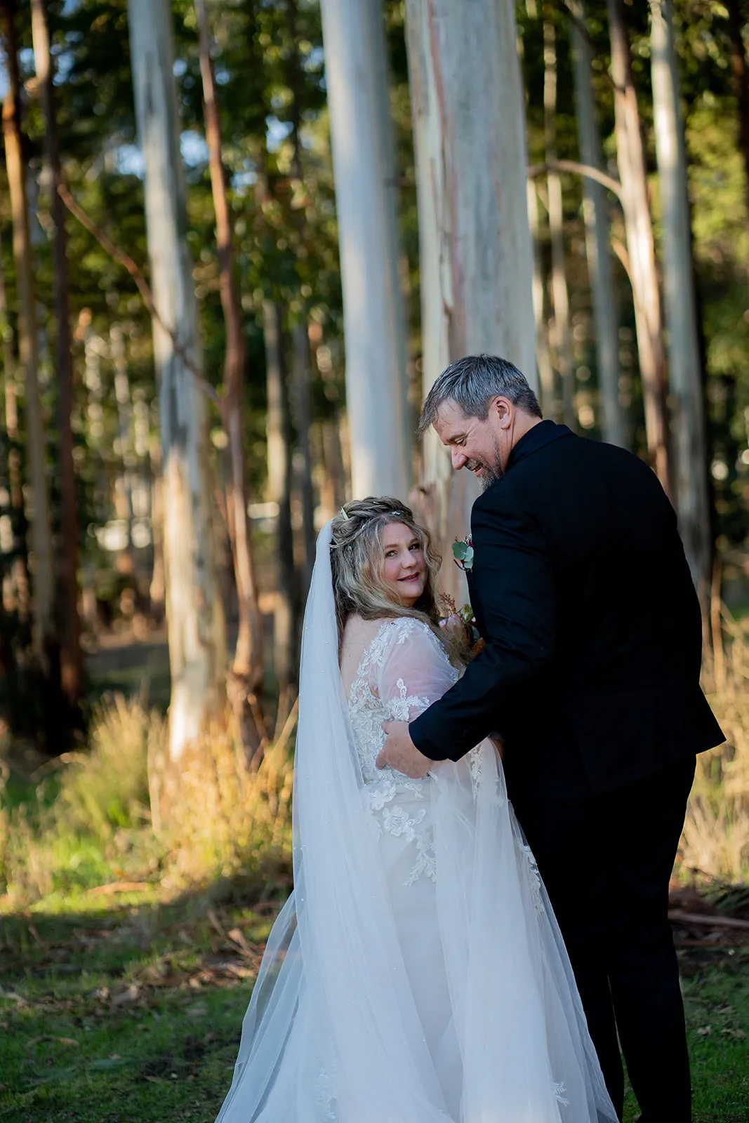 Intimate woodland portrait of the newlyweds